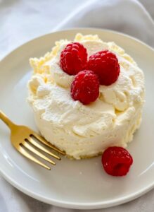 1 Minute Microwave Cheesecake in a mug, freshly cooked and creamy