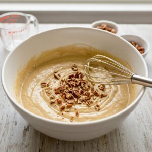 Keto Butter Pecan Cake batter with chopped pecans